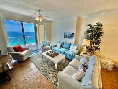 a living room with a couch and a table at Tropic Winds 2001 in Panama City Beach