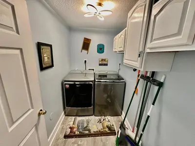 a small kitchen with a fish tank in a room at Ocean Reef 804 in Panama City Beach