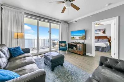 a living room with a couch and a bed at Emerald Isle 2305 in Panama City Beach
