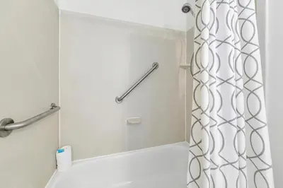 a shower in a bathroom with a shower curtain at Emerald Isle 2305 in Panama City Beach
