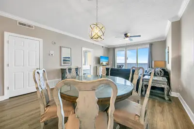 a dining room with a table and chairs at Ocean Villa 1803 in Panama City Beach