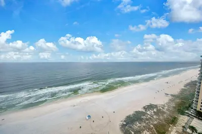 an aerial view of a beach with people on it at Ocean Villa 1803 in Panama City Beach