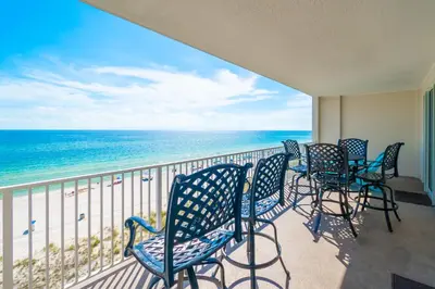 a balcony with chairs and a view of the ocean at Sugar Shores OR in Panama City Beach