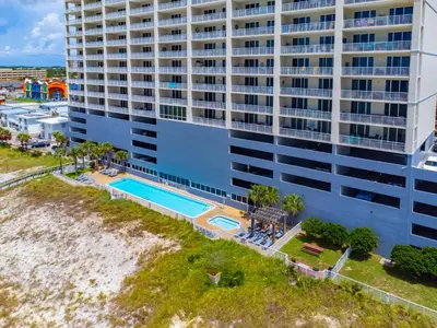 an aerial view of a large building with a swimming pool at Sugar Shores OR in Panama City Beach