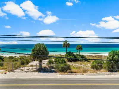 a view of the beach from a road at Sugar Sand Sunset in Panama City Beach