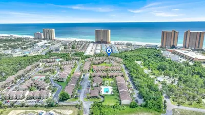 an aerial view of a resort in front of the ocean at Panama City Beach Oasis in Panama City Beach