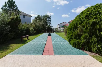a path in a park with a bench on it at St Thomas Square #1204C in Panama City Beach