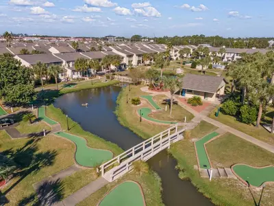 an aerial view of a subdivision with a bridge over a river at Gulf Highlands #222 in Panama City Beach