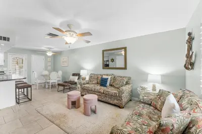 a living room with a couch and a table at Gulf Highlands #222 in Panama City Beach