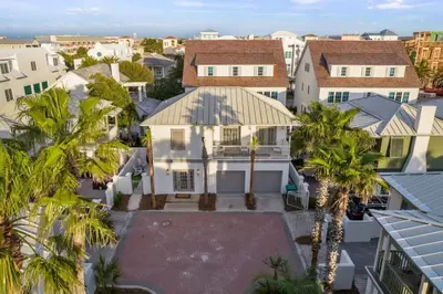 an aerial view of a house with palm trees at 30A Beach Villa Steps to Beach Dog Friendly with Peloton and Bikes in Rosemary Beach