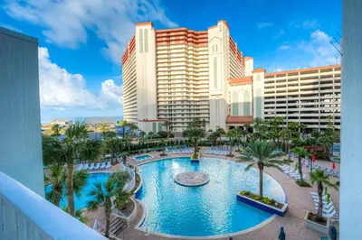 a view of a resort with a pool and palm trees at Laketown Wharf 1135 NEW in Panama City Beach