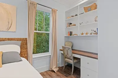 a bedroom with a bed desk and a window at 30A | Pool | Sunnyside Up | Walk to Beach| Golf Cart | Seagrove in Santa Rosa Beach