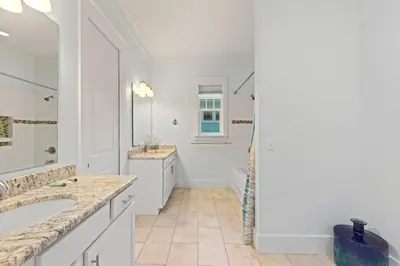 a white bathroom with two sinks and a mirror at 30A | Pool | Sunnyside Up | Walk to Beach| Golf Cart | Seagrove in Santa Rosa Beach