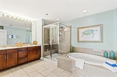 a large bathroom with a tub and a shower at Blue Turtle at Laketown in Panama City Beach