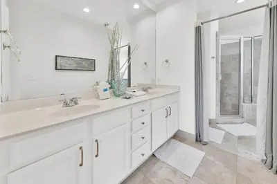 a white bathroom with a sink and a shower at Legacy 502 - Abalone in Santa Rosa Beach