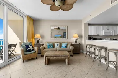 a living room with a couch and a table and chairs at Beachfront Retreat! Family Friendly 1BD Getaway! by Dolce Vita Getaways PCB! in Panama City Beach