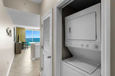 a living room with a television and a room with the ocean at Beachfront Retreat! Family Friendly 1BD Getaway! by Dolce Vita Getaways PCB! in Panama City Beach