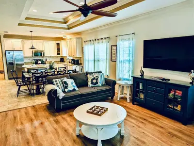 a living room with a couch and a table at Family Tides II in Panama City Beach