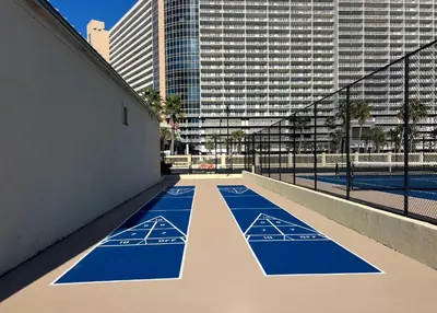 an empty basketball court in a city with tall buildings at Sunbird Resort! Stunning Beach and Ocean Views! by Dolce Vita Getaways PCB in Panama City Beach