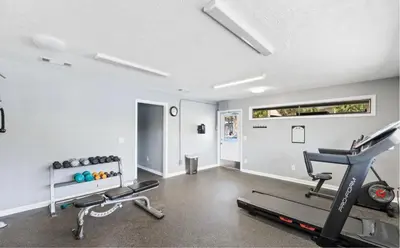 a gym with two treadmills and a treadmill at Charming Townhouse in Gulf Highland Beach Resort! Amenities Galore in Panama City Beach