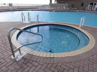 a small swimming pool with a hand rail in it at Tidewater 1616 in Panama City Beach