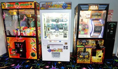 two arcade machines sitting next to each other at Tidewater 1616 in Panama City Beach