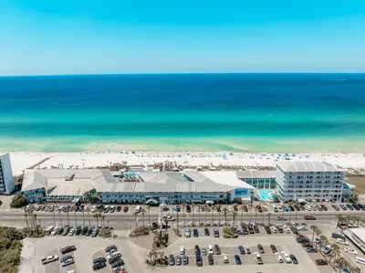 an aerial view of a resort and the beach at Sandpiper Beacon Beach Resort in Panama City Beach