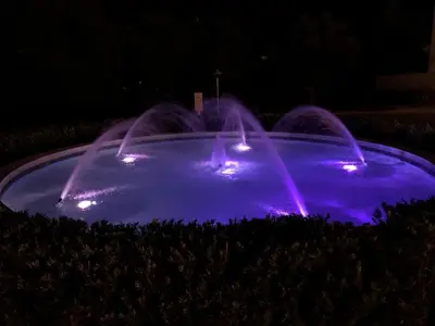 a pool of water with lights in the dark at The Pointe 333 in Inlet Beach