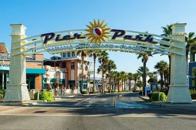 a large archway at the entrance to a amusement park at Mermaid's Delight - PCB, FL in Panama City Beach