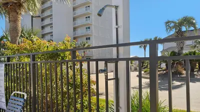 a balcony with a fence and a building at Emerald Hill 35 in Santa Rosa Beach