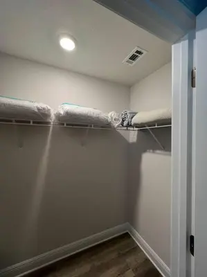 a room with three bunk beds in a room at PCB Townhome in Panama City Beach