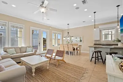a living room with a couch and a table at Seeking Sunsets 30A in Rosemary Beach