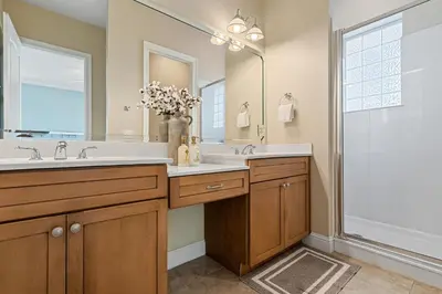 a bathroom with a double sink and a shower at Seeking Sunsets 30A in Rosemary Beach