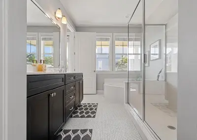 a bathroom with a tub and a sink and a shower at Seeking Sunsets 30A in Rosemary Beach
