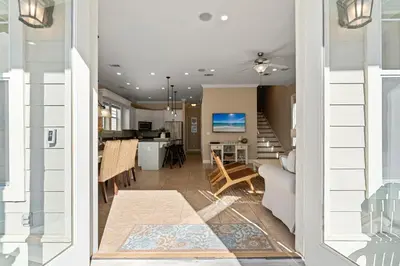 a view of a living room and dining room at Seeking Sunsets 30A in Rosemary Beach