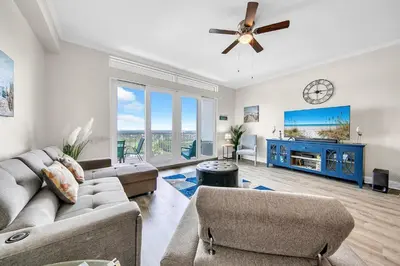 a living room with a couch and a tv at Laketown Wharf 2135 in Panama City Beach