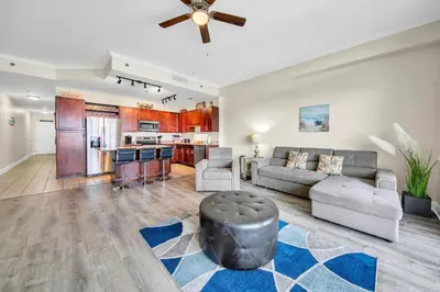a living room with a couch and a ceiling fan at Laketown Wharf 2135 in Panama City Beach
