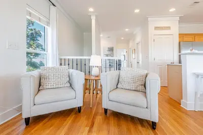 a living room with two chairs and a table at 30A Lemon Shello in Seacrest