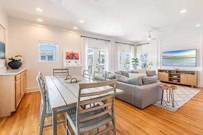 a kitchen and living room with a table and a couch at 30A Lemon Shello in Seacrest
