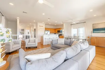 a living room with a couch and a kitchen at 30A Lemon Shello in Seacrest
