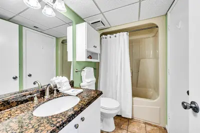 a bathroom with a sink and a toilet at Edgewater Golf Villa 3101 in Panama City Beach