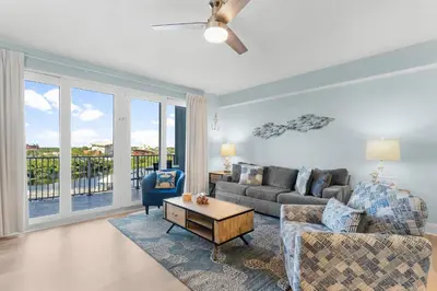 a living room with a couch and a table at Laketown Wharf #0414 in Panama City Beach