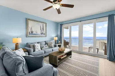 a living room with a couch and a ceiling fan at Laketown Wharf #1407 in Panama City Beach