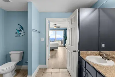 a bathroom with a sink and a toilet and a tub at Laketown Wharf #1407 in Panama City Beach