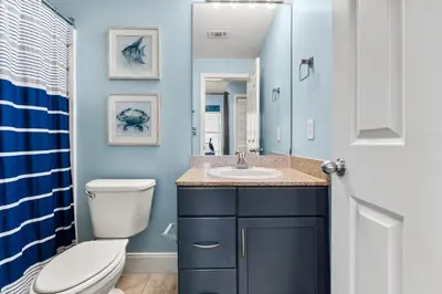 a bathroom with a toilet and a sink at Laketown Wharf #1407 in Panama City Beach