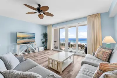 a living room with a view of the ocean at Laketown Wharf #0804 in Panama City Beach
