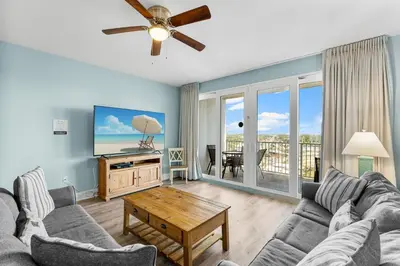 a living room with a couch and a tv at Laketown Wharf #1931 in Panama City Beach