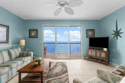 a living room with a couch and a television at Celadon #2106 in Panama City Beach