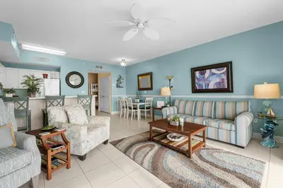a living room with a couch and a table at Celadon #2106 in Panama City Beach