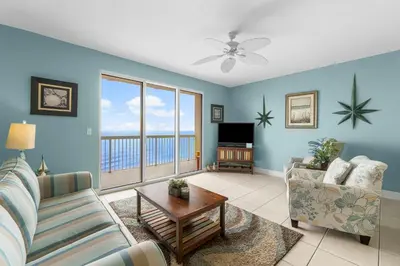 a living room with a couch and a table at Celadon #2106 in Panama City Beach